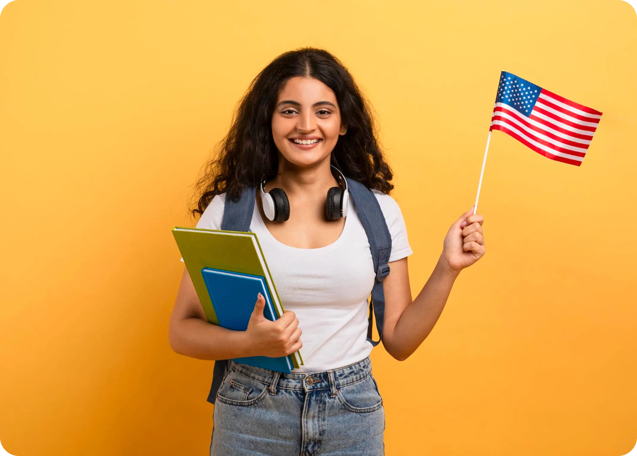 Student holding American flag with books
